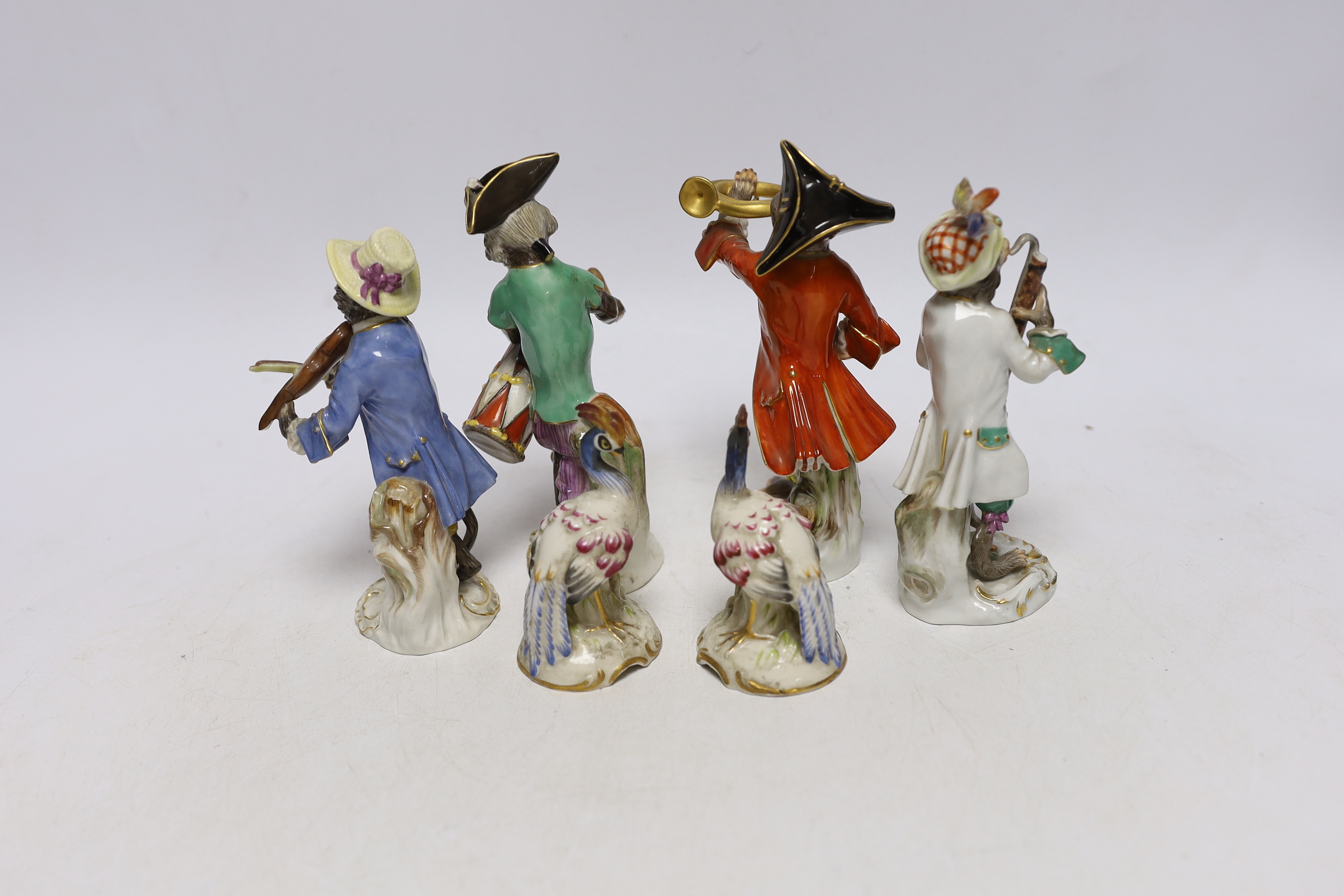 A 19th century four piece Meissen monkey band and a pair of Sampson pheasants